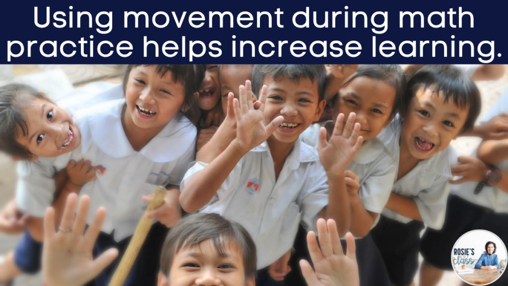 children in a classroom smiling and moving as they practice math