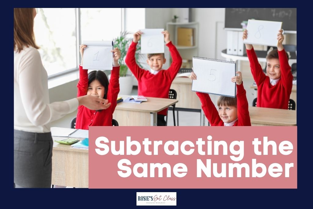 children in a classroom holding up whiteboards after subtracting with the same number