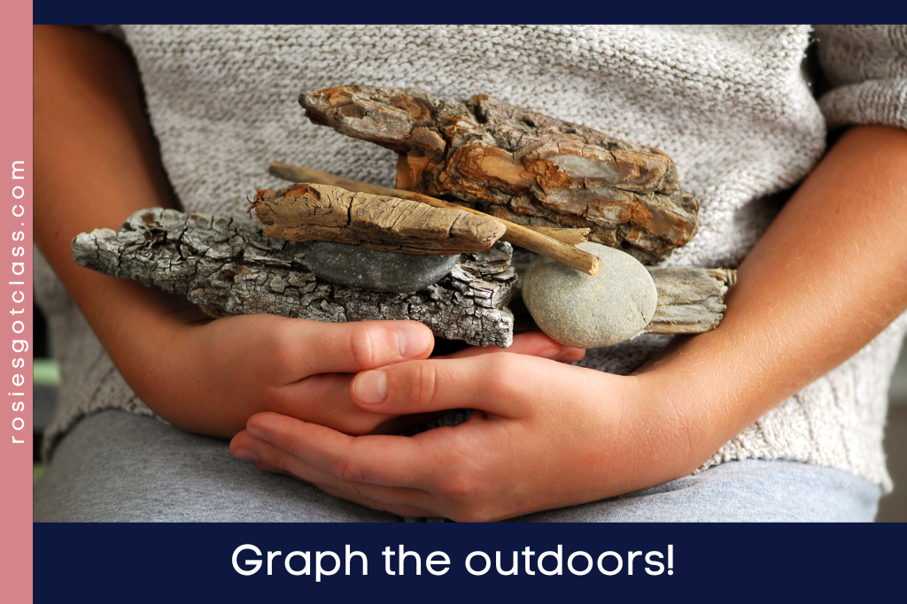 Child’s hands holding bark, a stick, and some rocks