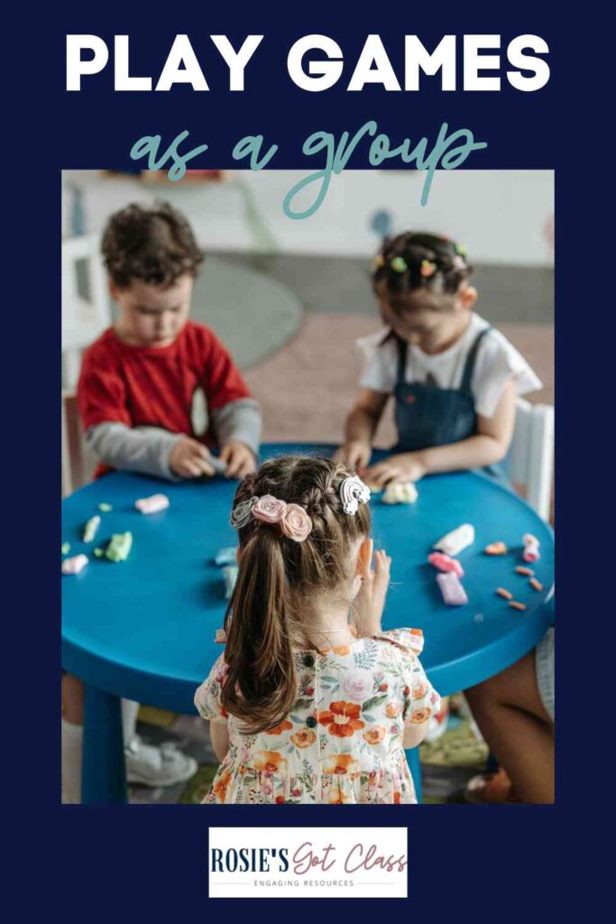 3 young children at a table playing math games to practice math facts