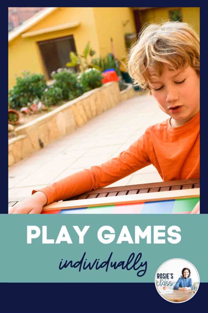 Young child playing a math game to practice math facts