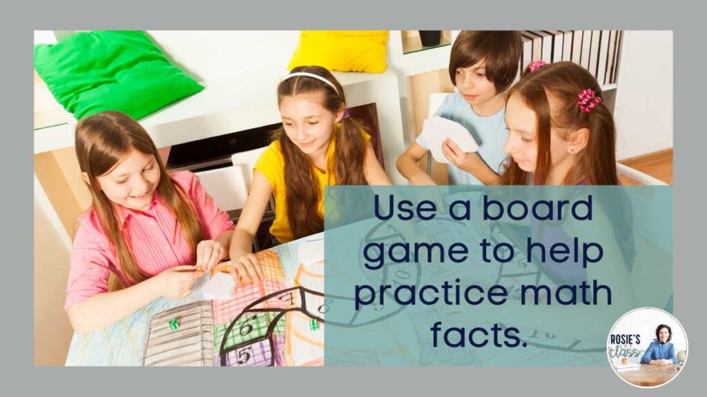 4 children using a handmade board game that uses dice and cards to practice math facts and says use a board game to help practice math facts