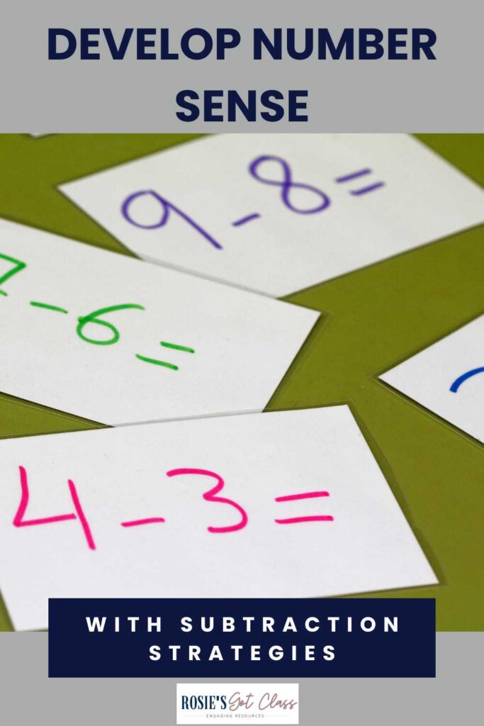 a few subtraction problems written on white cards